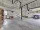 Spacious three car garage with white walls, side door, and ample storage space at 1873 S 510 E, Franklin, IN 46131