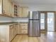 Kitchen with wood cabinets, stainless fridge and sliding glass door at 1873 S 510 E, Franklin, IN 46131