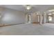 Expansive living room featuring neutral carpet, ceiling fan, and view to the entry at 1873 S 510 E, Franklin, IN 46131