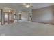 Open-concept living space with neutral carpet, arched doorways and views to the kitchen at 1873 S 510 E, Franklin, IN 46131