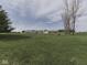 Expansive green property showcasing various outbuildings in a rural setting at 1873 S 510 E, Franklin, IN 46131