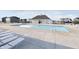A community pool on a sunny day with lounge chairs and a covered cabana at 18769 Moray St, Westfield, IN 46074