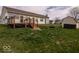 Well-maintained backyard with a deck, stairs and shed, offering ample space for outdoor activities and storage at 2179 W Van Arsdall Ct, Columbus, IN 47201