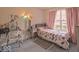 Cozy bedroom with a large window, closet and comfortable decor at 2179 W Van Arsdall Ct, Columbus, IN 47201