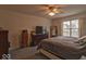 Bedroom featuring a bed, large window, and furniture at 2179 W Van Arsdall Ct, Columbus, IN 47201