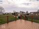 Spacious wooden deck with black metal railing, perfect for outdoor entertaining and enjoying backyard views at 2179 W Van Arsdall Ct, Columbus, IN 47201