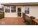 Lovely deck with railing and a door leading into the house, perfect for relaxing and entertaining guests at 2179 W Van Arsdall Ct, Columbus, IN 47201