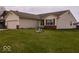Well-kept single-Gathering home with a two-car garage, complemented by a lush green lawn at 2179 W Van Arsdall Ct, Columbus, IN 47201