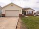 Charming single-Gathering home with a two-car garage, vinyl siding, and a well-maintained front lawn at 2179 W Van Arsdall Ct, Columbus, IN 47201