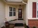 Charming entryway with decorative accents, a storm door, and sidelight windows at 2179 W Van Arsdall Ct, Columbus, IN 47201