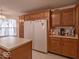 Kitchen featuring wood cabinetry, countertops, and modern appliances at 2179 W Van Arsdall Ct, Columbus, IN 47201