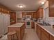 Well-lit kitchen featuring an island, modern appliances, and ample counter space at 2179 W Van Arsdall Ct, Columbus, IN 47201