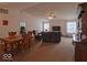 Open-concept living room with a dining table and comfortable seating area at 2179 W Van Arsdall Ct, Columbus, IN 47201