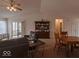 Spacious living room featuring comfortable seating and a view of the dining area at 2179 W Van Arsdall Ct, Columbus, IN 47201