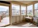 Sunroom with multiple windows and a door leading to the backyard at 2179 W Van Arsdall Ct, Columbus, IN 47201