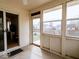 Sunroom featuring multiple windows and a sliding door leading to the backyard at 2179 W Van Arsdall Ct, Columbus, IN 47201