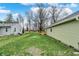 A tranquil view of the yard, surrounded by trees and neighboring houses at 2264 Walnut W St, Greenfield, IN 46140