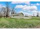 Wide shot of the property with lush yard space and the home's appealing architectural features at 2264 Walnut W St, Greenfield, IN 46140