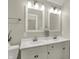Bathroom features a dual sink vanity, with neutral paint and modern lighting at 2264 Walnut W St, Greenfield, IN 46140