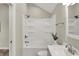 Bright bathroom featuring a tub-shower combo with tile surround and a modern vanity at 2264 Walnut W St, Greenfield, IN 46140