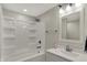 Bright bathroom featuring a tub-shower combo with tile surround and a modern vanity at 2264 Walnut W St, Greenfield, IN 46140