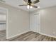 This bedroom features wood-look floors, a ceiling fan, and a closet with sliding doors at 2264 Walnut W St, Greenfield, IN 46140