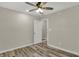 This bedroom features wood-look floors, a ceiling fan, and neutral paint at 2264 Walnut W St, Greenfield, IN 46140