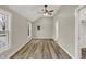 This bedroom features wood-look floors, high ceilings, and two large windows at 2264 Walnut W St, Greenfield, IN 46140