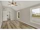 Bright bedroom featuring wood-look floors, a ceiling fan, and a neutral paint scheme at 2264 Walnut W St, Greenfield, IN 46140