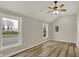 This bedroom features wood-look floors, high ceilings, and two large windows at 2264 Walnut W St, Greenfield, IN 46140
