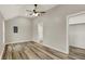 This bedroom features wood-look floors, high ceilings, and a ceiling fan at 2264 Walnut W St, Greenfield, IN 46140