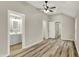 This bedroom features wood-look floors, high ceilings, and a ceiling fan at 2264 Walnut W St, Greenfield, IN 46140