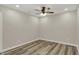 Spacious bedroom featuring modern ceiling fan, recessed lighting, and luxury vinyl plank flooring at 2264 Walnut W St, Greenfield, IN 46140