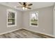 Bedroom featuring luxury vinyl plank flooring and two windows for ample natural light at 2264 Walnut W St, Greenfield, IN 46140