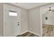 Bright entryway featuring a modern front door with glass and wood-look floors at 2264 Walnut W St, Greenfield, IN 46140