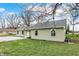 Green sided house with a gravel driveway at 2264 Walnut W St, Greenfield, IN 46140