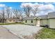 Green sided house with gravel driveway and simple landscaping at 2264 Walnut W St, Greenfield, IN 46140