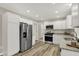 Bright kitchen with white cabinets, granite counters, and stainless steel appliances at 2264 Walnut W St, Greenfield, IN 46140