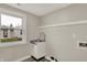 A clean and modern laundry room with a stainless steel utility sink at 2264 Walnut W St, Greenfield, IN 46140