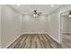 Open living room showcases luxury vinyl plank flooring and recessed lighting at 2264 Walnut W St, Greenfield, IN 46140