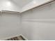 A clean walk-in closet with shelving and wood-look floors at 2264 Walnut W St, Greenfield, IN 46140