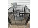 View of air conditioner condenser outside with metal cage secured around unit at 2338 N Harding St, Indianapolis, IN 46208