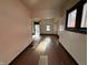 Empty room featuring hardwood floors and white walls at 2338 N Harding St, Indianapolis, IN 46208