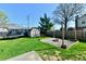 Backyard featuring a fire pit and shed with a sprawling lawn for outdoor activities at 260 Christina Dr, Whiteland, IN 46184