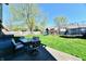 Green backyard featuring a patio, furniture, playset, and trampoline for outdoor enjoyment at 260 Christina Dr, Whiteland, IN 46184