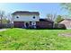 Expansive backyard featuring a patio and well-manicured lawn, perfect for outdoor gatherings at 260 Christina Dr, Whiteland, IN 46184