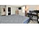 Well-lit bedroom featuring a closet, TV, dresser, and desk, providing a comfortable and functional space at 260 Christina Dr, Whiteland, IN 46184