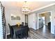 Lovely dining area with a modern chandelier, seating for four, and stylish gray walls at 260 Christina Dr, Whiteland, IN 46184