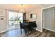 Bright dining area featuring sliding glass doors, backyard access, and contemporary lighting at 260 Christina Dr, Whiteland, IN 46184