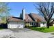 Inviting single-Gathering home with an attached garage, mature trees, and front-yard American flag at 260 Christina Dr, Whiteland, IN 46184